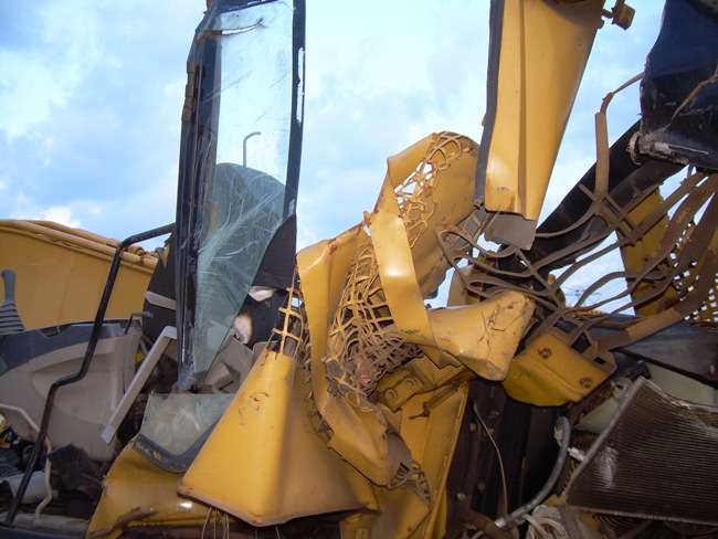 Destroyed Caterpillar excavator